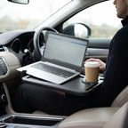 Steering wheel desk holding a laptop and coffee in a parked car