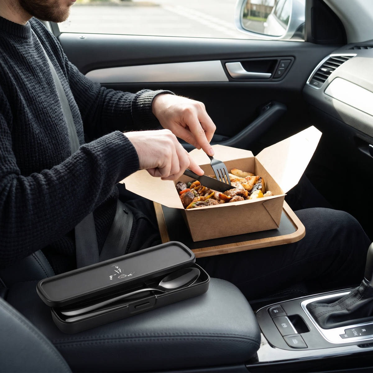 Eating a takeaway in a parked car with the stainless steel knife and fork